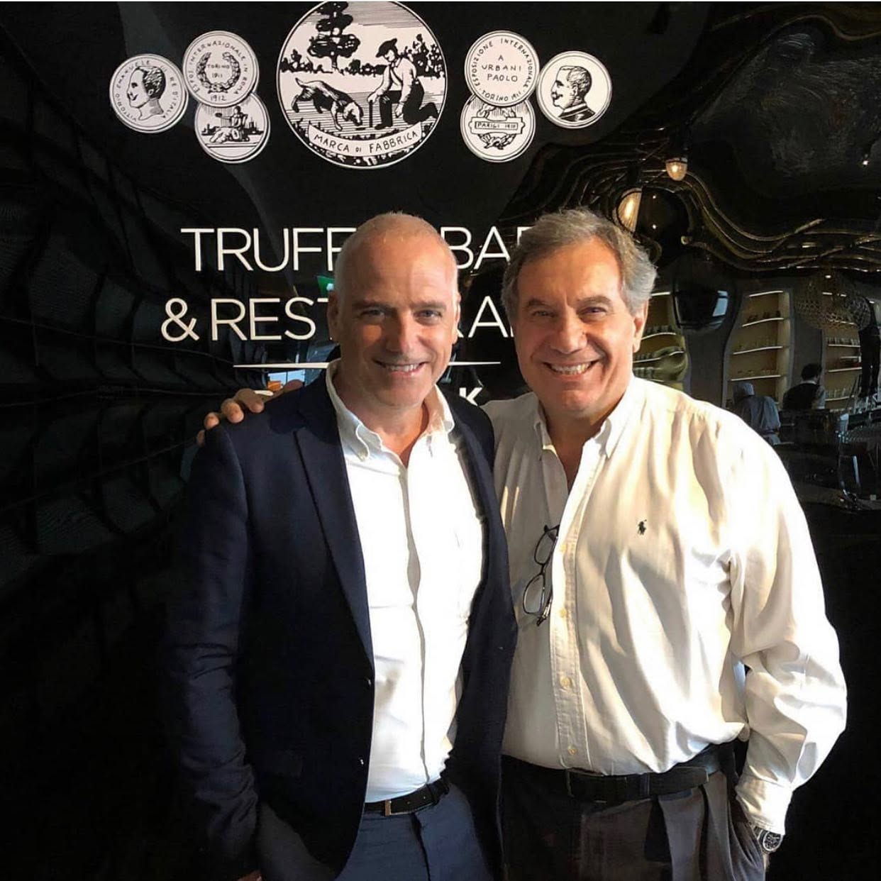 Roberto Ugolini with a hospitality industry partner